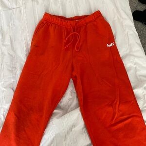levi’s orange baggy sweatpants